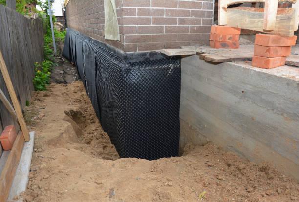 Happy homeowners after waterproofing job in Central Islip